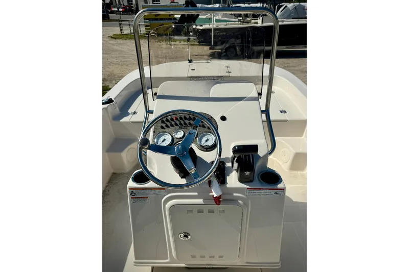 Slide: The Image of 2025 Carolina Skiff 17 LS boat console with steering wheel and controls. - 9