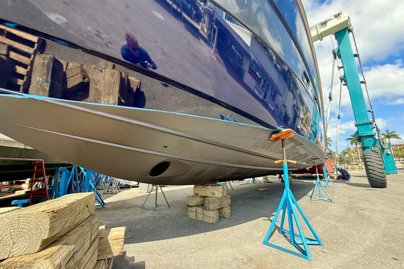Slide: The Image of 2014 Azimut Verve 40 yacht on stands, undergoing maintenance at a shipyard. - 11