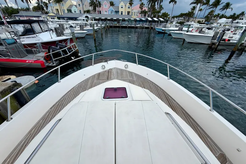 Slide: The Image of Azimut Verve 40 yacht docked in a marina, surrounded by boats and colorful buildings. - 13