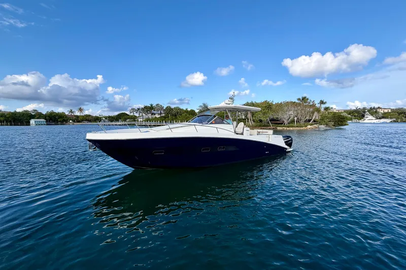 Slide: The Image of 2014 Azimut Verve 40 yacht on calm water under a clear blue sky. - 2
