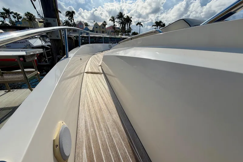 Slide: The Image of 2014 Azimut Verve 40 yacht deck with sleek design and wooden flooring. - 20