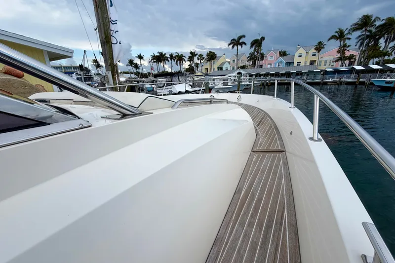 Slide: The Image of 2014 Azimut Verve 40 yacht docked near colorful waterfront buildings and palm trees. - 21