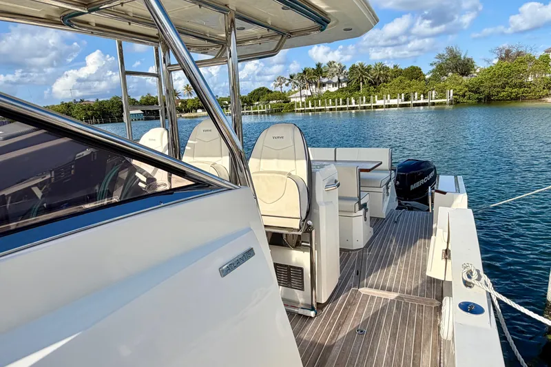 Slide: The Image of 2014 Azimut Verve 40 yacht with sleek deck design, docked by serene waters. - 24