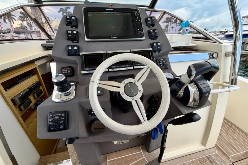Slide: The Image of Helm of 2014 Azimut Verve 40 yacht with steering wheel and navigation controls. - 26