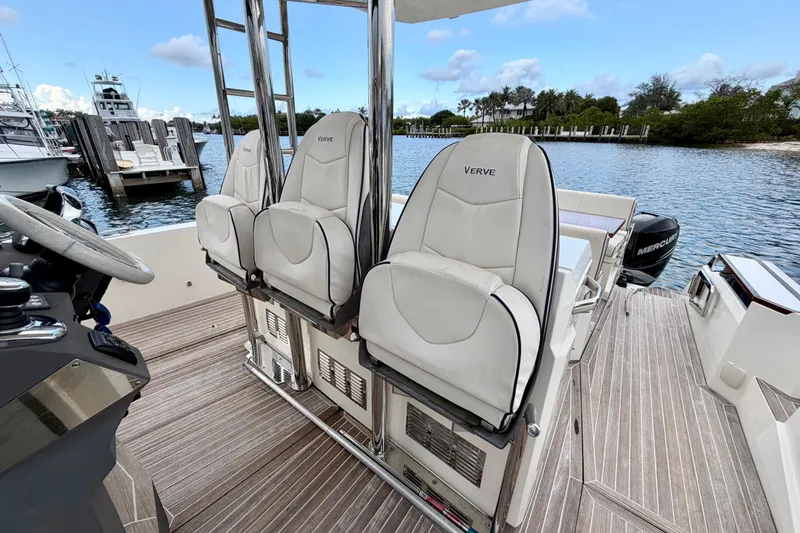 Slide: The Image of 2014 Azimut Verve 40 yacht interior with white seats and wooden deck. - 28