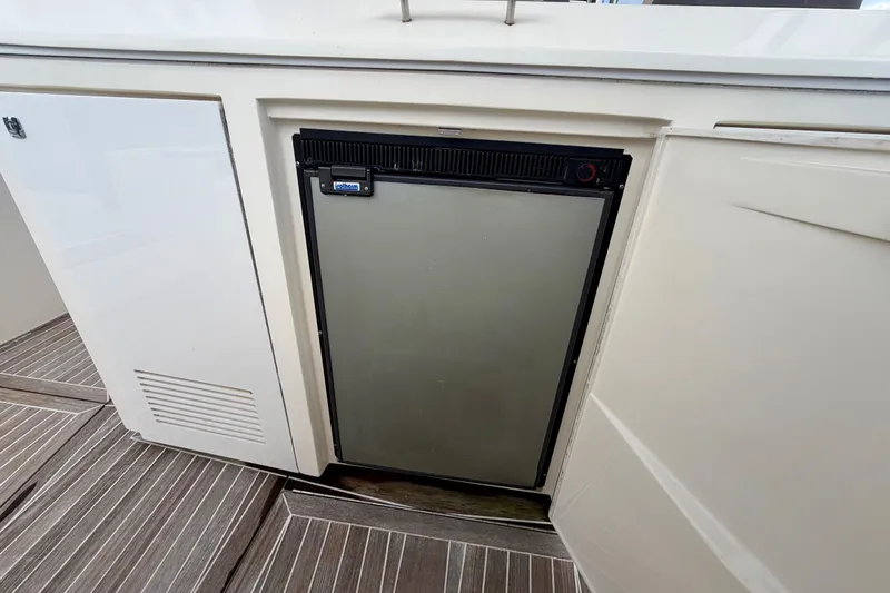 Slide: The Image of Built-in refrigerator on 2014 Azimut Verve 40 yacht, featuring sleek cabinetry design. - 39