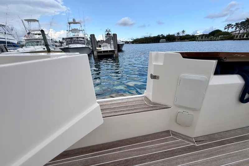 Slide: The Image of Azimut Verve 40 yacht docked at marina, showcasing sleek design and water view. - 40