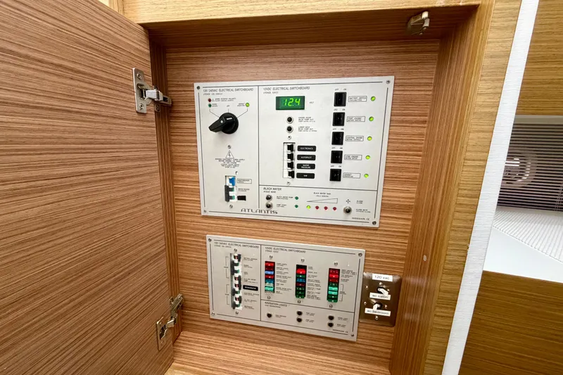 Slide: The Image of Electrical switchboard panel inside 2014 Azimut Verve 40 yacht, featuring various controls and indicators. - 51