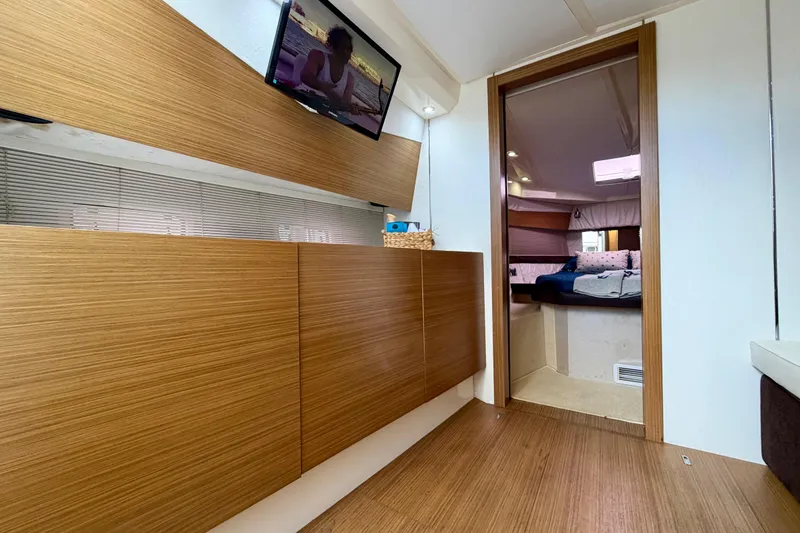 Slide: The Image of Interior of 2014 Azimut Verve 40 yacht with modern wood paneling and cozy cabin. - 56