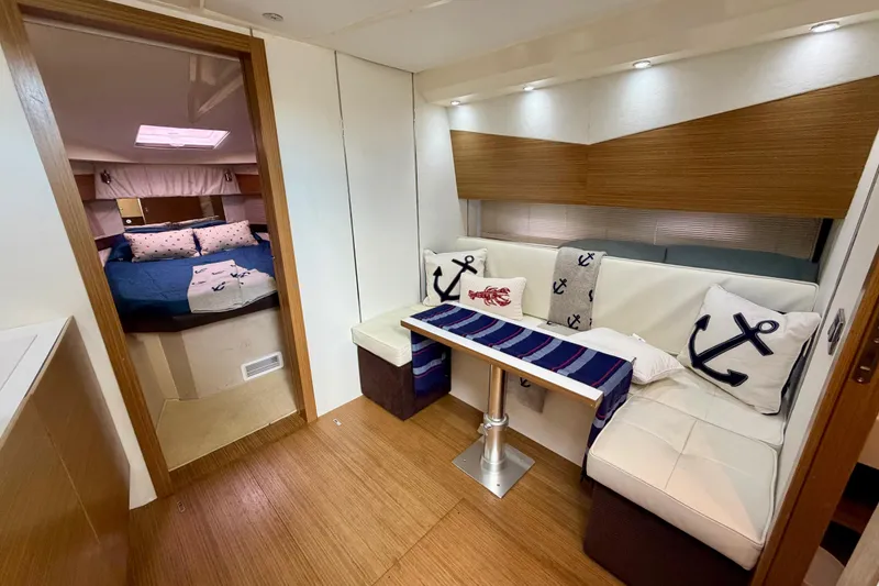 Slide: The Image of Interior of 2014 Azimut Verve 40 yacht with cozy seating and nautical decor. - 57