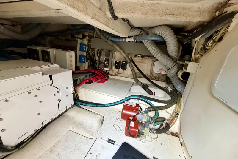 Slide: The Image of Engine room of 2014 Azimut Verve 40 yacht, showcasing mechanical components and wiring. - 71