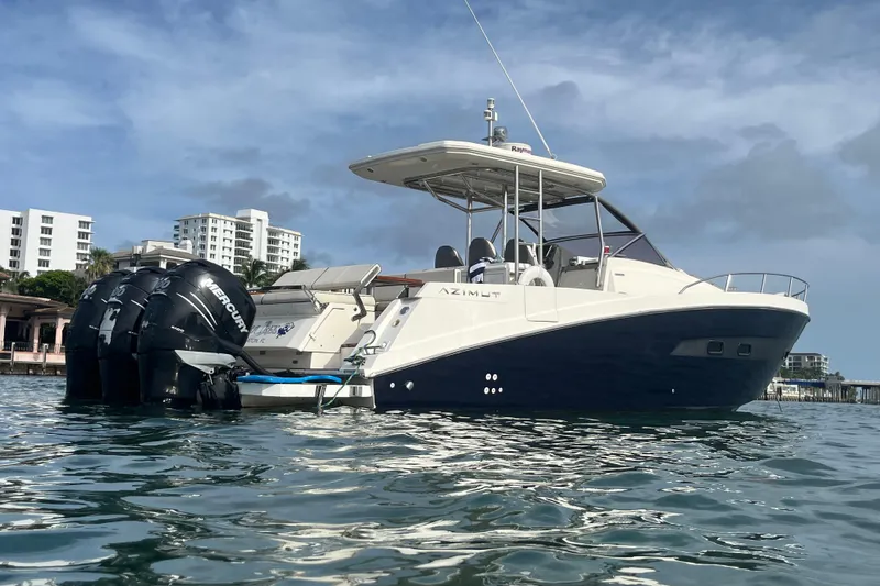 Slide: The Image of Azimut Verve 40 yacht, 2014 model, on water with cityscape background. - 8