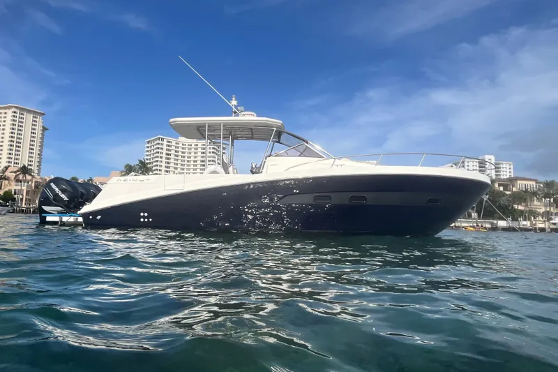 Slide: The Image of Azimut Verve 40 yacht, 2014 model, on water with cityscape background. - 9