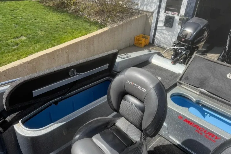 Slide: The Image of 2015 Nitro ZV21 boat interior with Mercury Pro XS engine and storage compartments. - 15