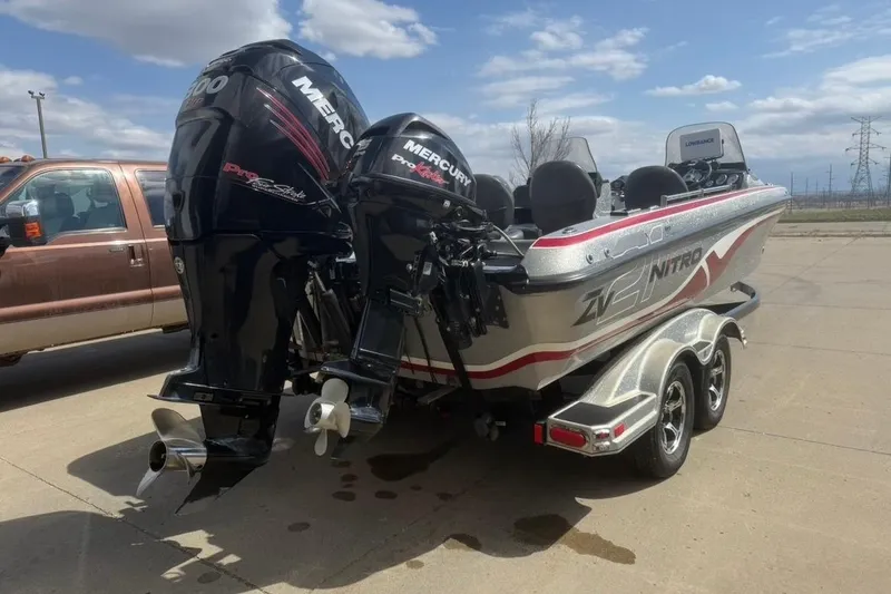 Slide: The Image of 2015 Nitro ZV21 boat with dual Mercury engines on a trailer. - 5