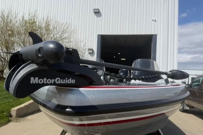 Slide: The Image of 2015 Nitro ZV21 boat with MotorGuide trolling motor, parked outside a building. - 7