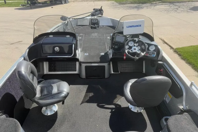 Slide: The Image of Interior of a 2015 Nitro ZV21 boat with steering console and seating. - 8