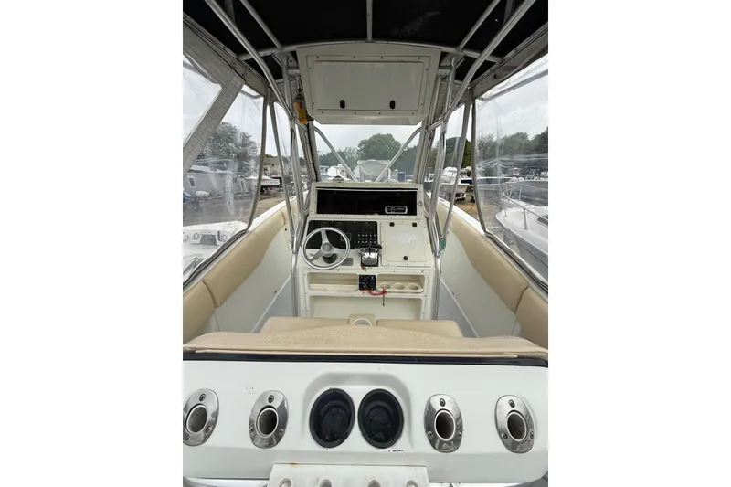 Slide: The Image of 2003 Hydra-Sports Vector 2800 CC boat cockpit with steering wheel and control panel. - 15