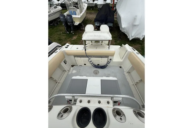 Slide: The Image of 2003 Hydra-Sports Vector 2800 CC boat interior with seating and storage compartments. - 18