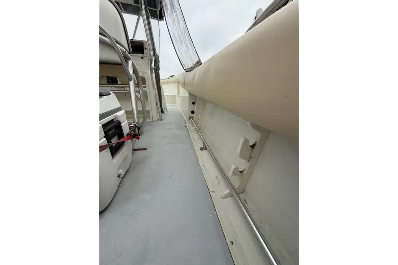 Slide: The Image of 2003 Hydra-Sports Vector 2800 CC interior view, showcasing seating and deck details. - 22