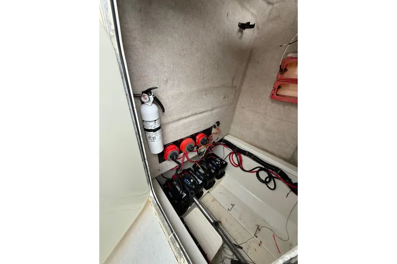 Slide: The Image of 2003 Hydra-Sports Vector 2800 CC interior showing electrical components and fire extinguisher. - 23