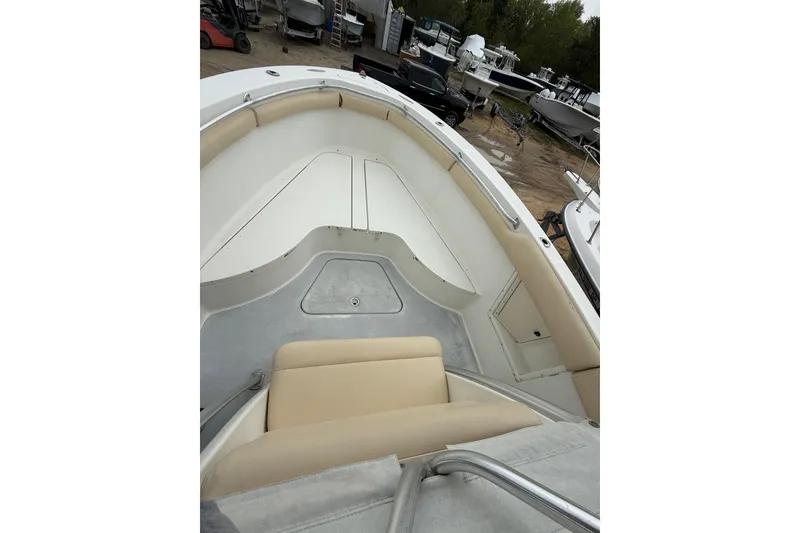 Slide: The Image of 2003 Hydra-Sports Vector 2800 CC boat interior with beige seating and storage compartments. - 26