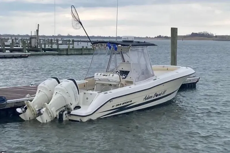 Slide: The Image of 2003 Hydra-Sports Vector 2800 CC boat docked with twin engines in a marina. - 3