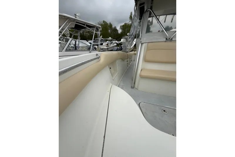 Slide: The Image of 2003 Hydra-Sports Vector 2800 CC boat interior with beige seating and sleek design. - 31