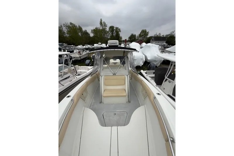 Slide: The Image of 2003 Hydra-Sports Vector 2800 CC boat interior with seating, docked among other boats. - 33
