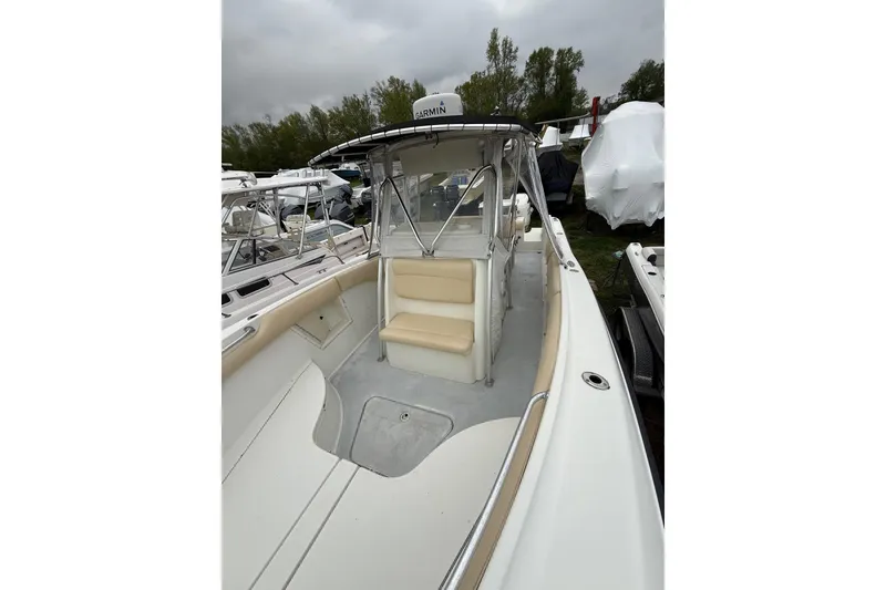 Slide: The Image of 2003 Hydra-Sports Vector 2800 CC boat with beige seating and Garmin equipment. - 34