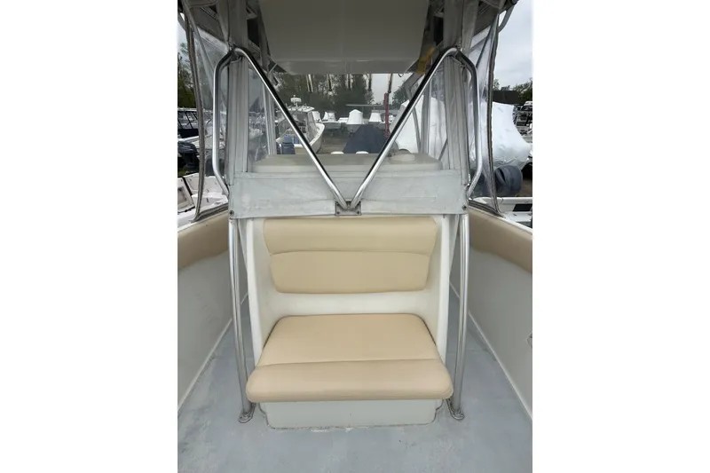 Slide: The Image of 2003 Hydra-Sports Vector 2800 CC boat interior with beige seating and metal frame. - 36