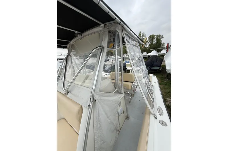 Slide: The Image of 2003 Hydra-Sports Vector 2800 CC boat with clear enclosure and seating area. - 38