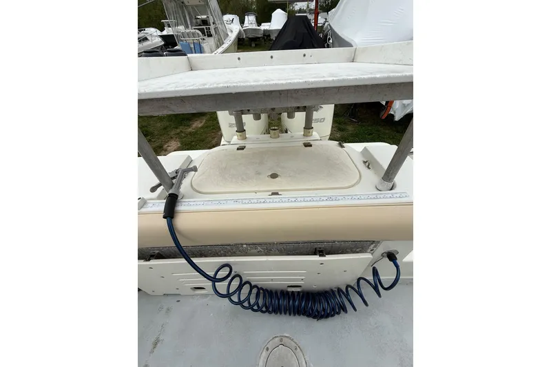 Slide: The Image of 2003 Hydra-Sports Vector 2800 CC boat deck with coiled hose and storage compartment. - 43