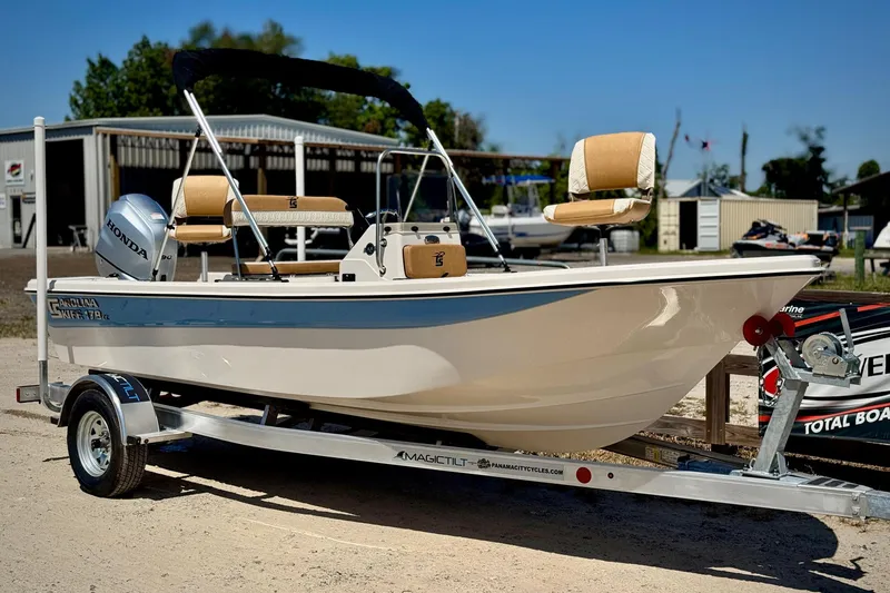 The Image of 2025 Carolina Skiff 178 JLS boat on trailer, featuring Honda outboard motor. - 0