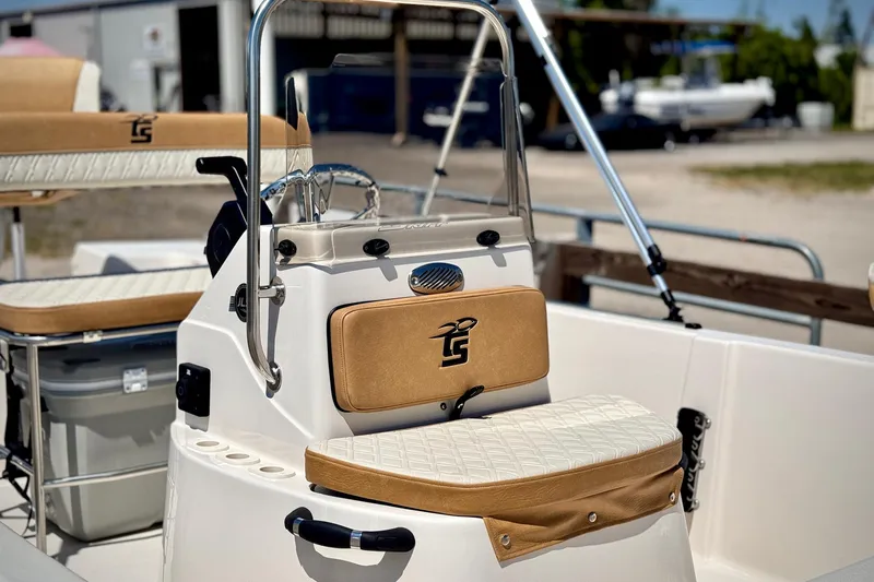 Slide: The Image of 2025 Carolina Skiff 178 JLS boat interior with tan and white seating. - 17