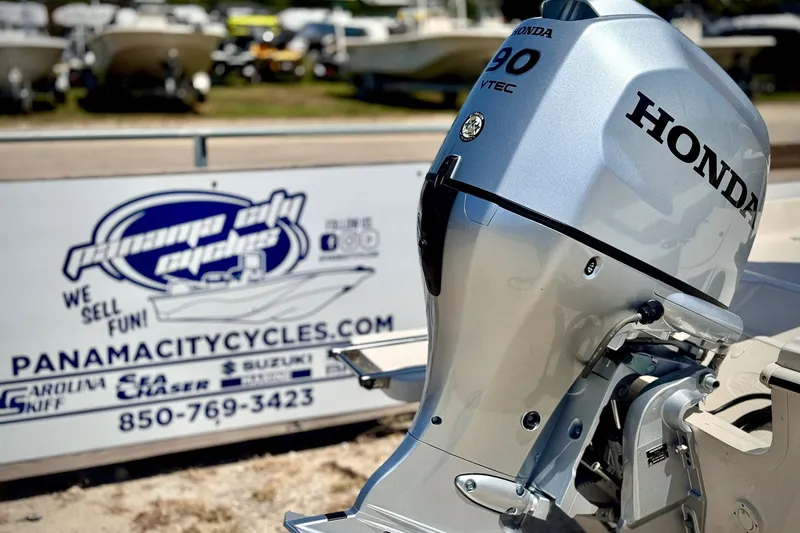Slide: The Image of 2025 Carolina Skiff 178 JLS with Honda outboard motor at Panama City Cycles dealership. - 3