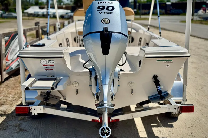 Slide: The Image of 2025 Carolina Skiff 178 JLS boat with Honda 90 VTEC engine on trailer. - 30
