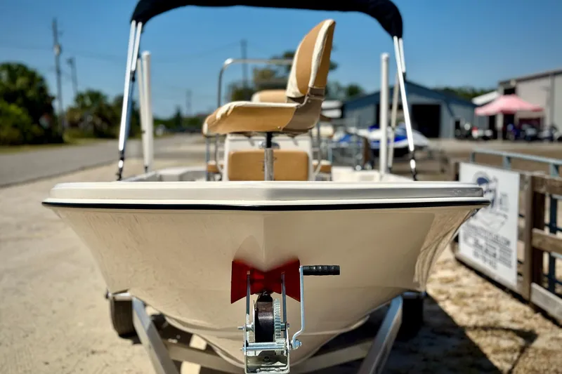Slide: The Image of 2025 Carolina Skiff 178 JLS boat on trailer, outdoor setting. - 32