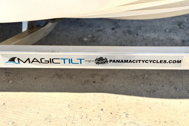 Slide: The Image of Trailer with "Magic Tilt" branding and PanamaCityCycles.com URL, for Carolina Skiff 178 JLS 2025. - 33