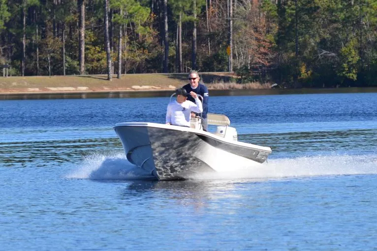 Slide: The Image of Manufacturer Provided Image: 2025 Carolina Skiff 178 JLS boat cruising on a serene lake. - 35