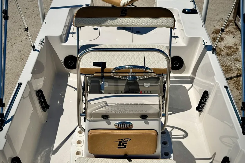 Slide: The Image of 2025 Carolina Skiff 178 JLS boat interior with steering console and seating. - 4