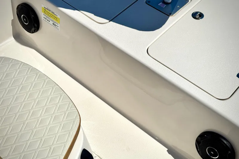 Slide: The Image of 2025 Carolina Skiff 178 JLS boat interior with speaker and textured seat detail. - 5