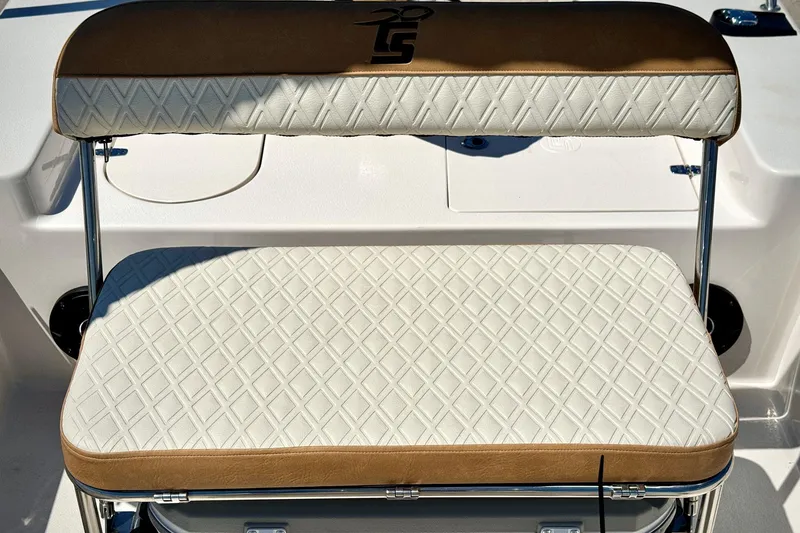 Slide: The Image of 2025 Carolina Skiff 178 JLS boat seat with diamond-patterned upholstery and brown accents. - 9