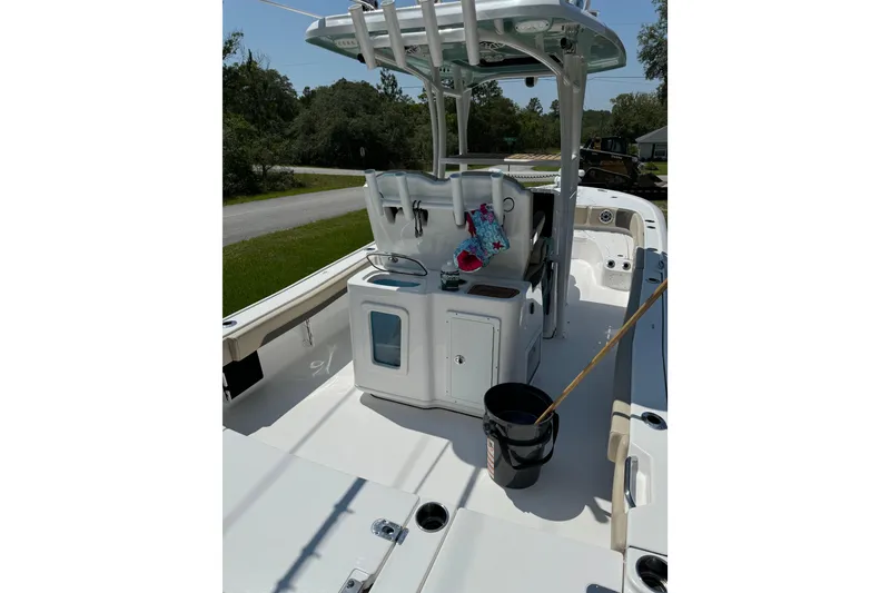 Slide: The Image of 2024 Tidewater 2700 Carolina Bay boat interior with console and seating area. - 6
