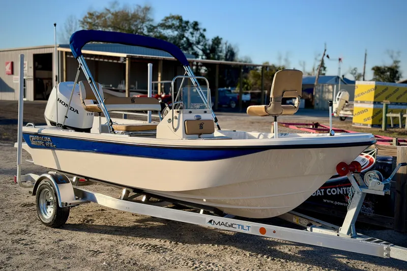 The Image of 2026 Carolina Skiff 178 JLS boat on trailer with Honda engine, parked outdoors. - 0