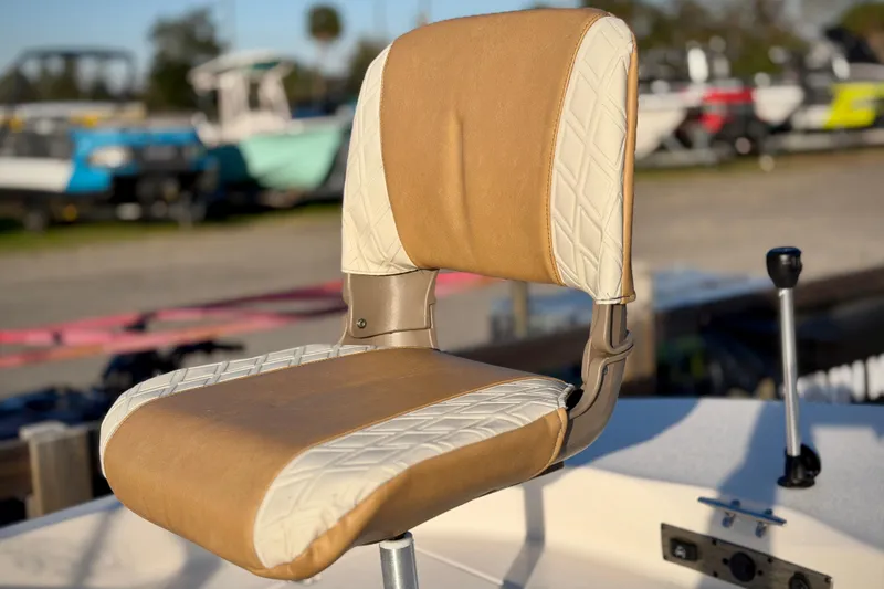 Slide: The Image of 2026 Carolina Skiff 178 JLS boat seat with tan and white upholstery. - 13