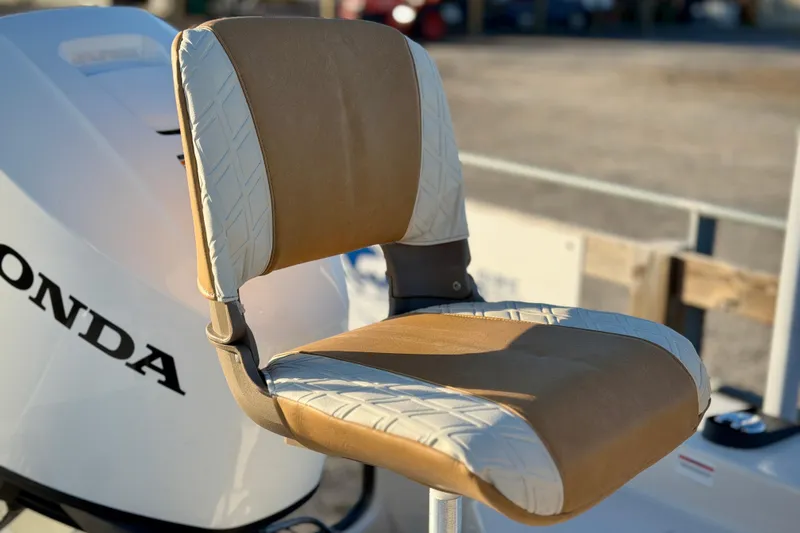 Slide: The Image of Boat seat on a 2026 Carolina Skiff 178 JLS with Honda engine in background. - 14