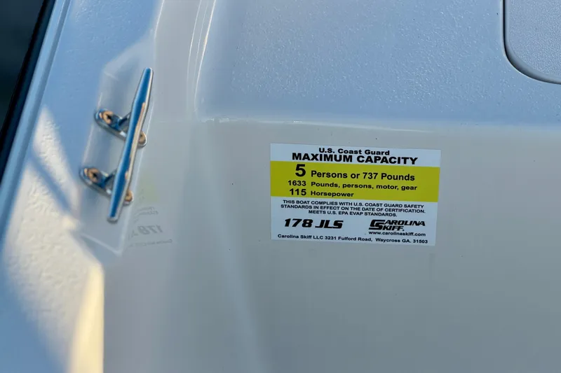 Slide: The Image of 2026 Carolina Skiff 178 JLS capacity label, showing maximum 5 persons or 737 pounds. - 18