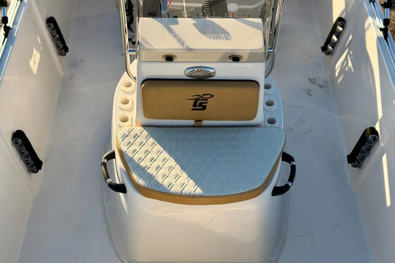 Slide: The Image of 2026 Carolina Skiff 178 JLS boat interior with cushioned seating and storage compartments. - 20