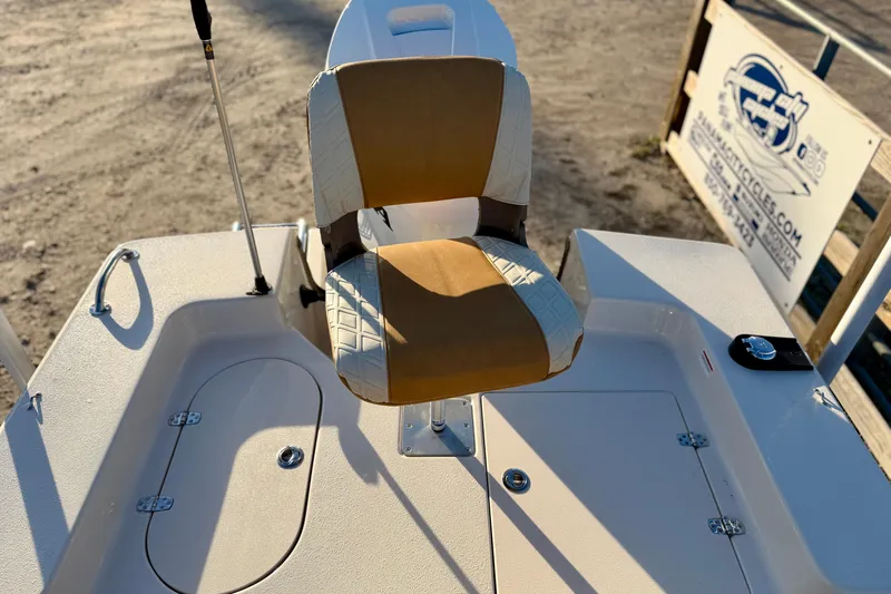 Slide: The Image of 2026 Carolina Skiff 178 JLS boat seat and deck, featuring storage compartments. - 24